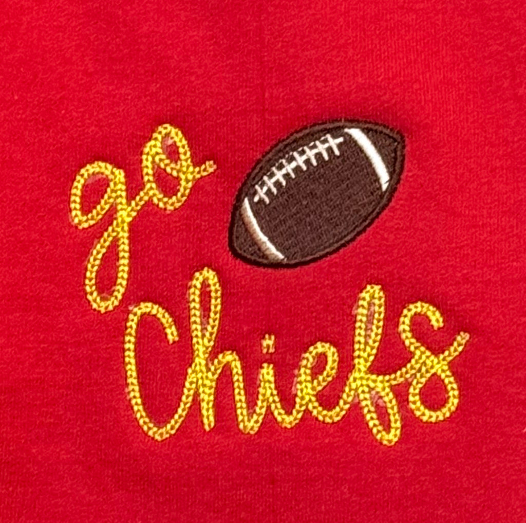 Embroidered football and 'go Chiefs' text on a red background